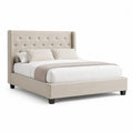 Lit plateforme 160 x 200 cm tête de lit capitonnée à boutons tissu polyester beige structure bois MDF pieds bois noir